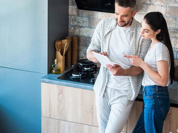 couple at home looking at home automation software