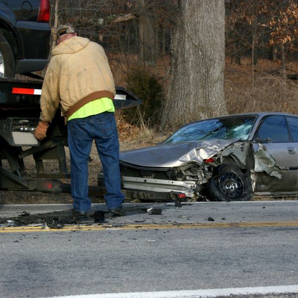 a crashed car being towed 4 Signs You Need Professional Towing.jpg