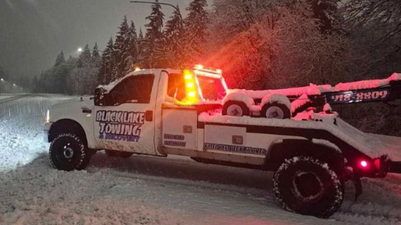 Black Lake Towing truck in snow 