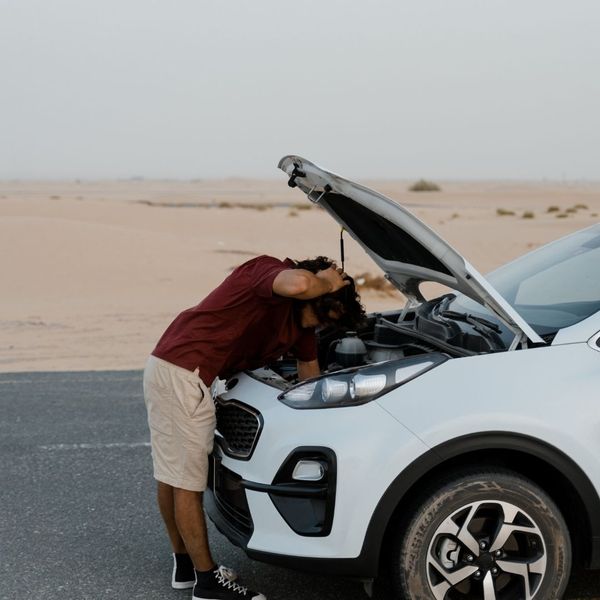 man looking under the hood 