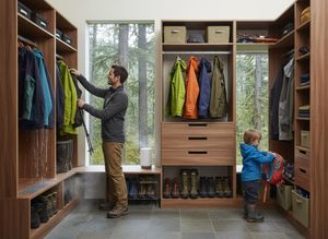Man and Child Organizing Outdoor Gear in Custom Mudroom