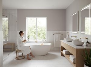 Woman Relaxing in Modern Bathroom with Freestanding Bathtub and Window View