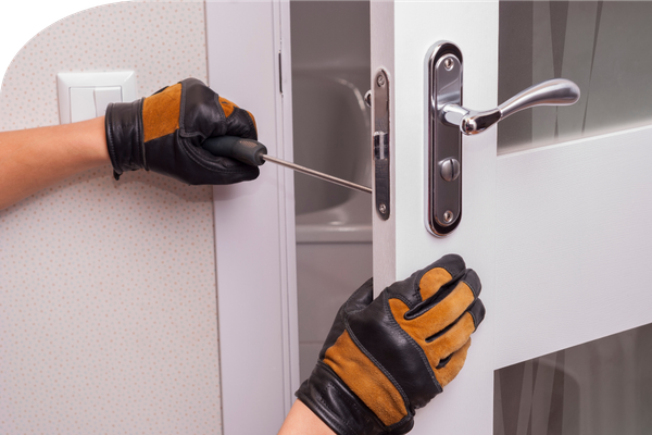 a handyman fixing a door knob