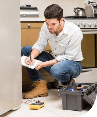 a handyman working on a repair in a kitchen
