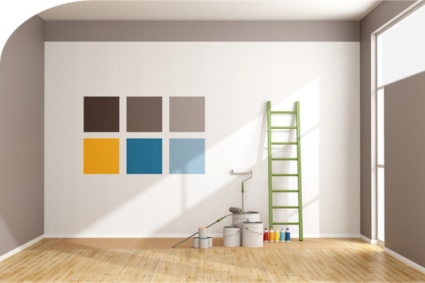 paint colors swatched on a wall, with a ladder, paint, and brushes nearby