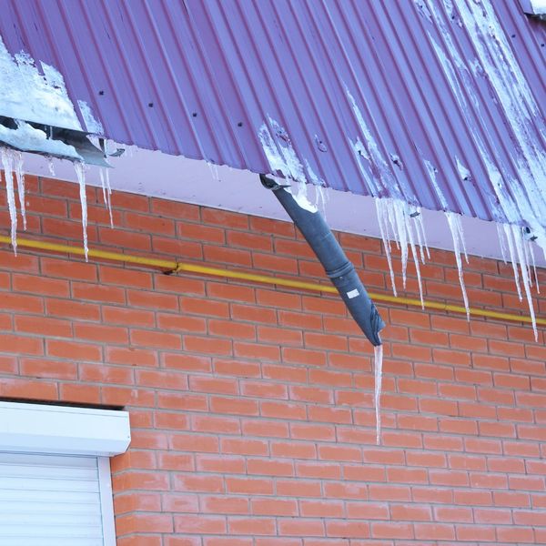 Roof with ice damage after a storm