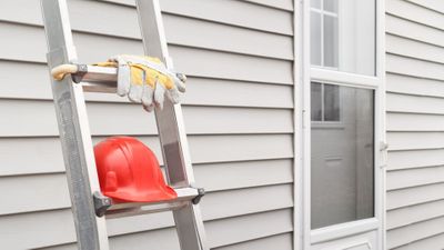 ladder against new siding on house 
