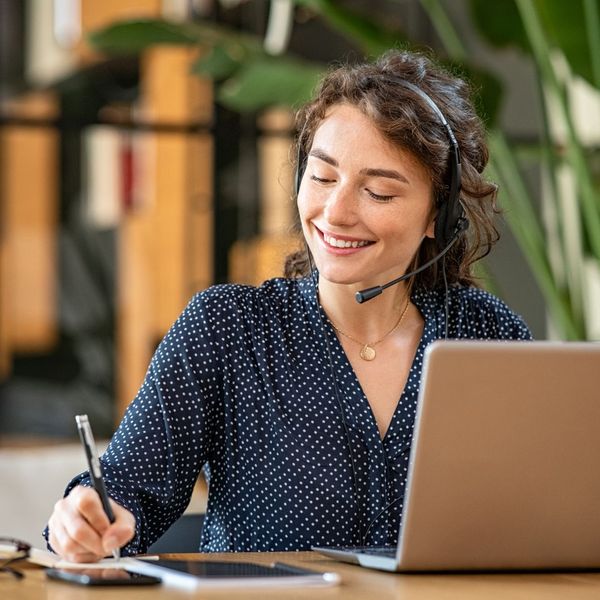 woman customer service representative taking notes