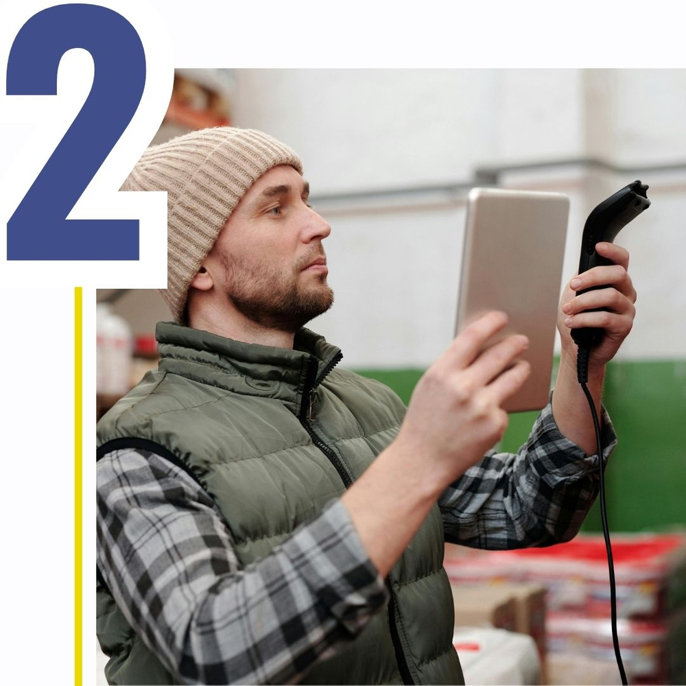 numeral 2, worker with tablet scanning barcode