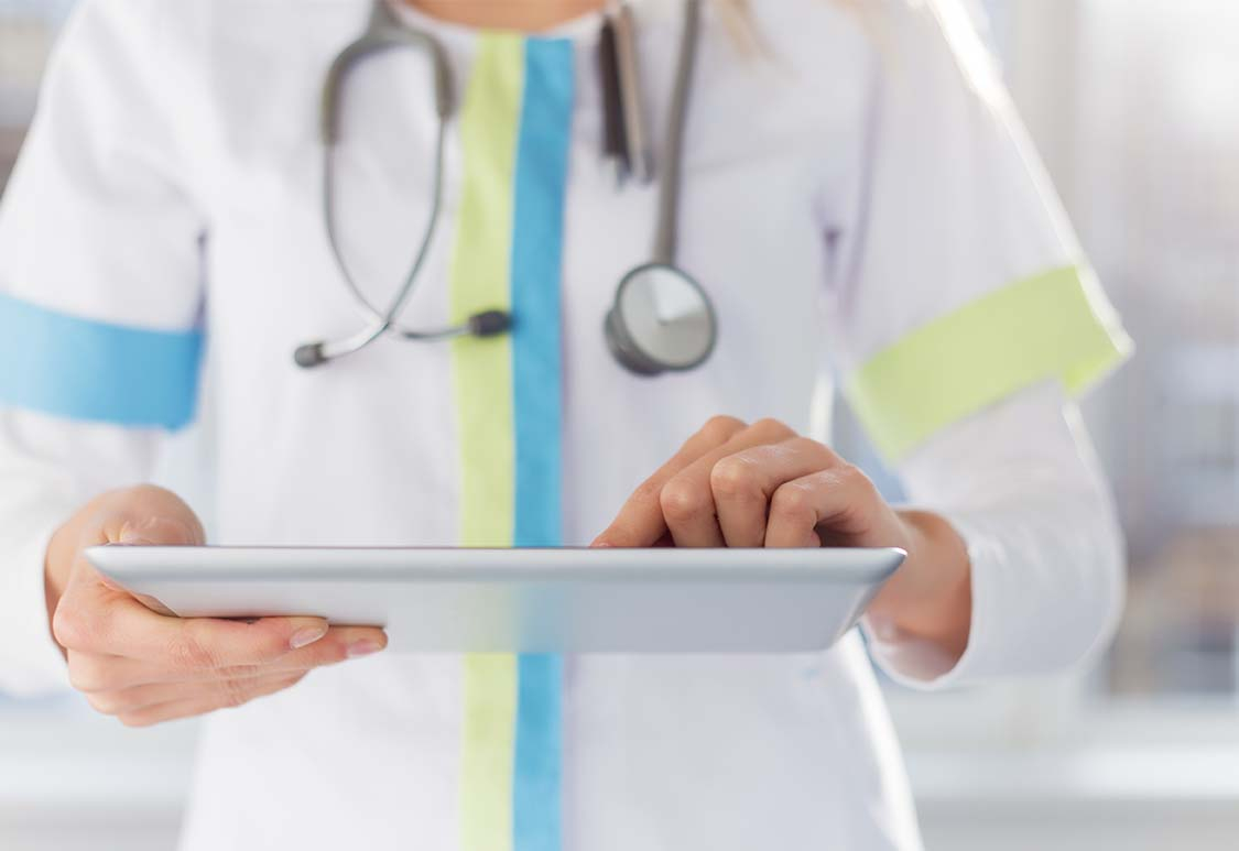 Medical personnel looking at tablet