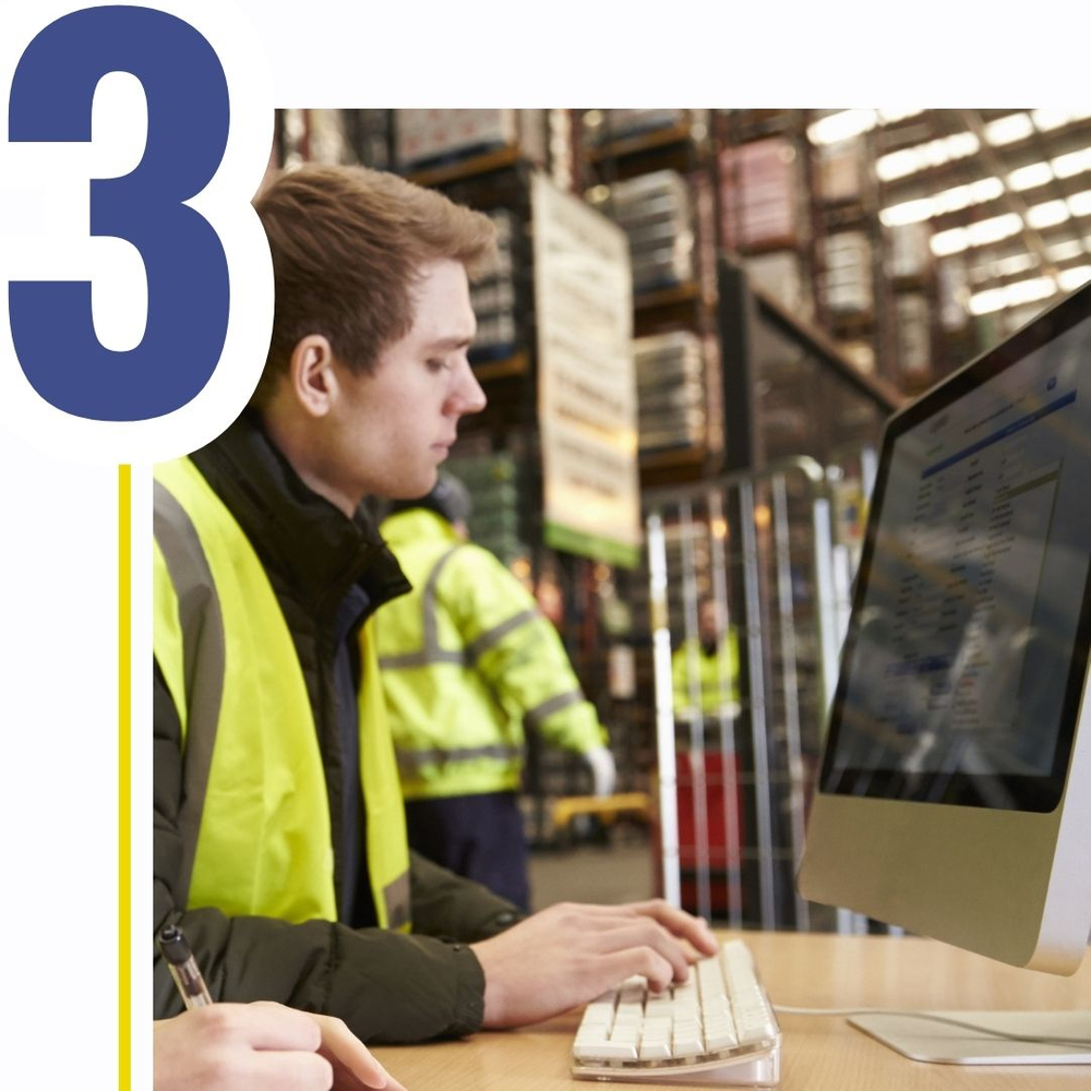 numeral 3, warehouse worker using computer