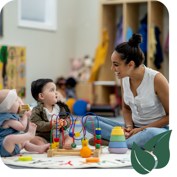 Daycare teacher playing with toddlers