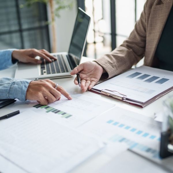 two professional people working on business taxes