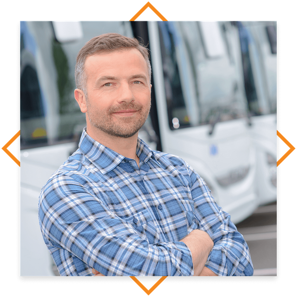 Smiling business owner with newly insured vehicles