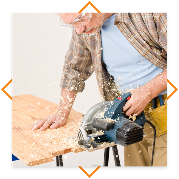 photo of a contractor using a saw