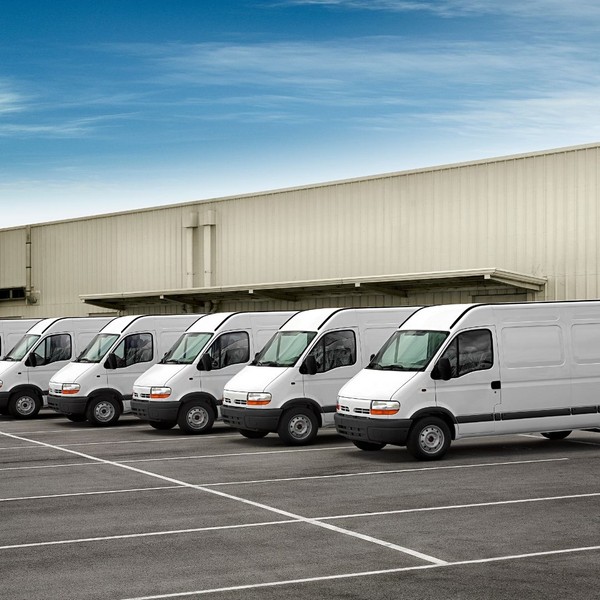 a fleet of vans parked next to each other