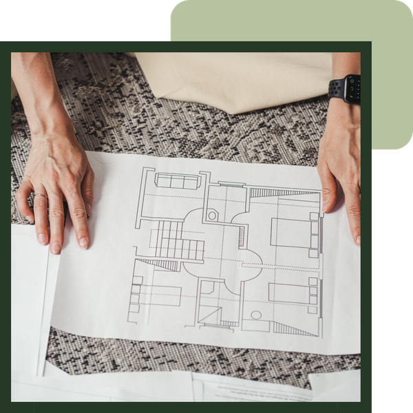 Hands holding a blueprint