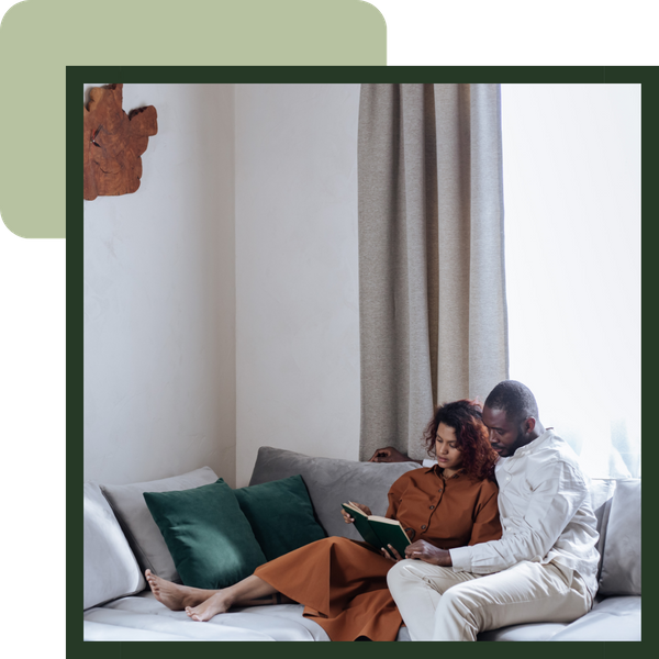 Man and woman reading on a couch