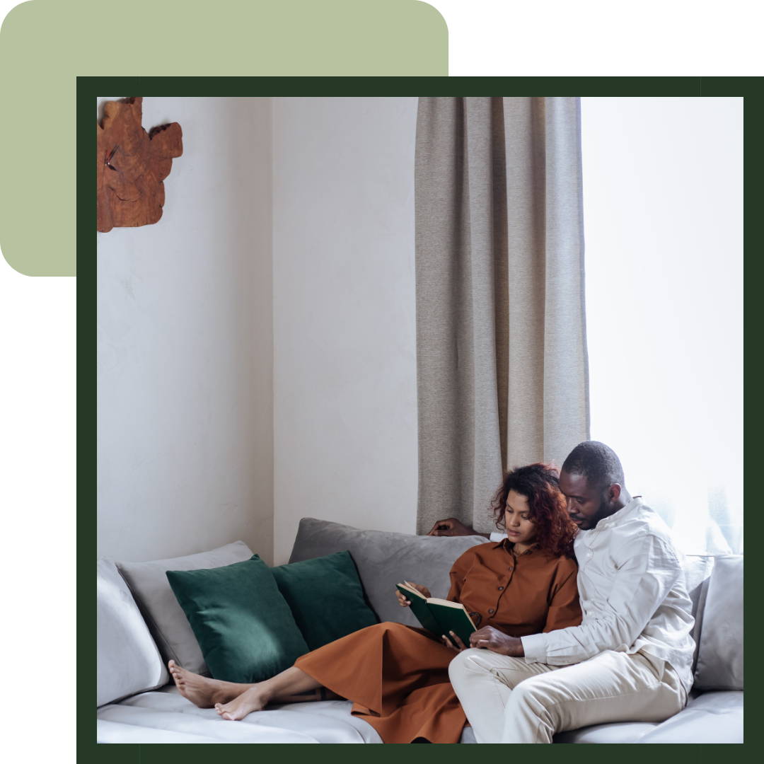 Man and woman reading on a couch