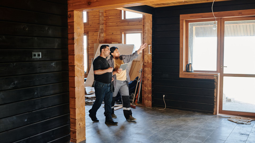 homeowner and a contractor discussing a whole home renovation project
