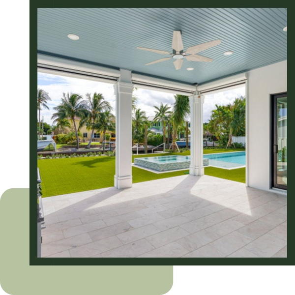 Wide view of a backyard with a pool