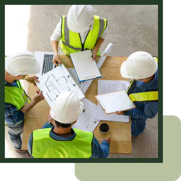 construction workers looking over home plans construction workers looking over home plans