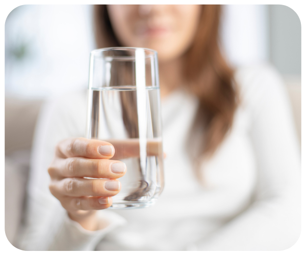 Woman holding a glass of water