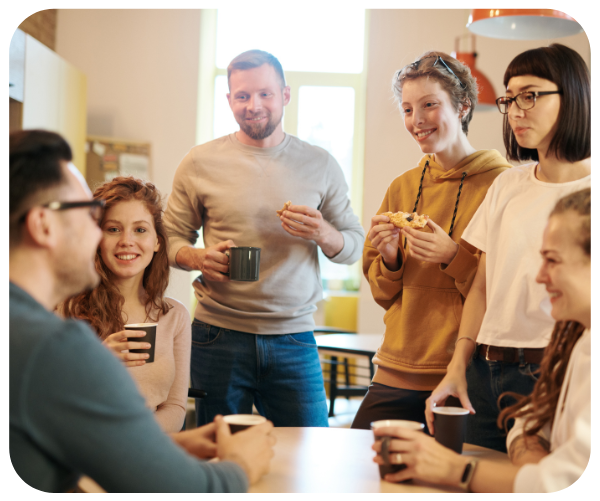 team drinking coffee in breakroom