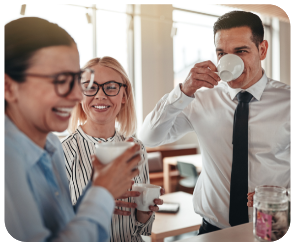 People in an office drinking coffee