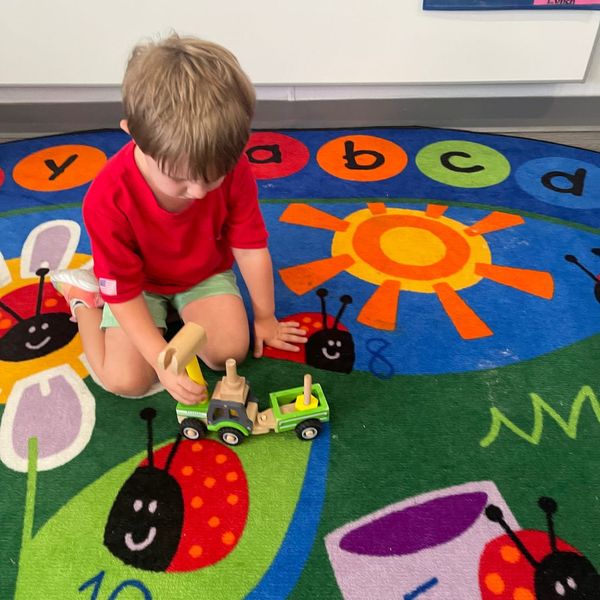 child playing on a colorful rug Preparing for Fall3.jpg