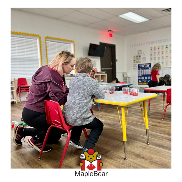 A teacher working with a young student Education Benefits-1a.png
