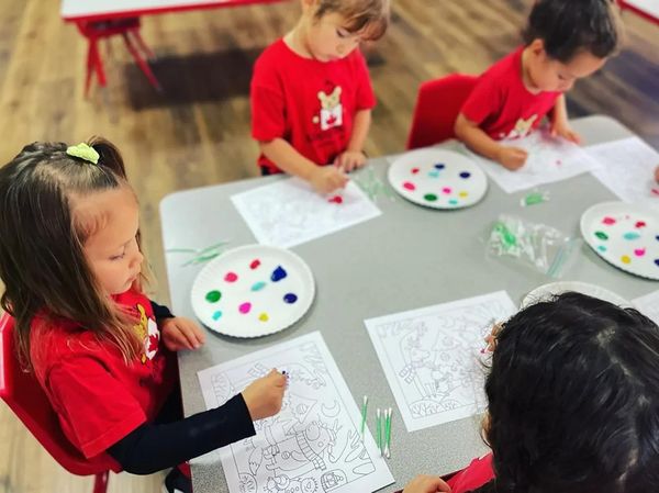children painting coloring book pages