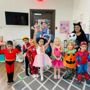 Maple Bear Justin Road caregivers and kids dressed up for Halloween