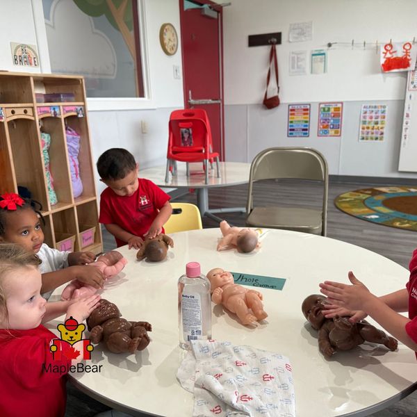 depict young children (perhaps toddlers or preschoolers) interacting with baby dolls, possibly in a play scenario that involves care-giving or mimicry, which can indirectly support communication and imaginative play. The Importance of Early Childhood Education in Shaping New Learners 1.jpg