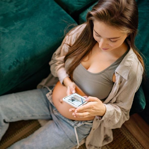 pregnant woman building gallery on her phone