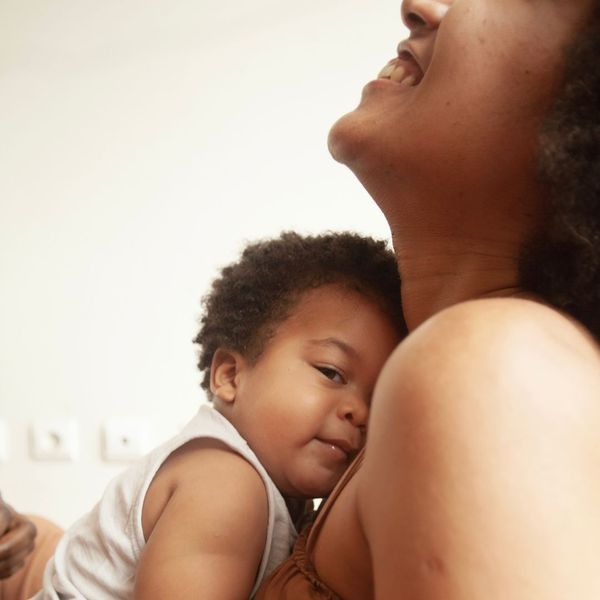 smiling mom with newborn