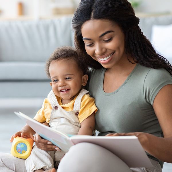 mom and baby reading book