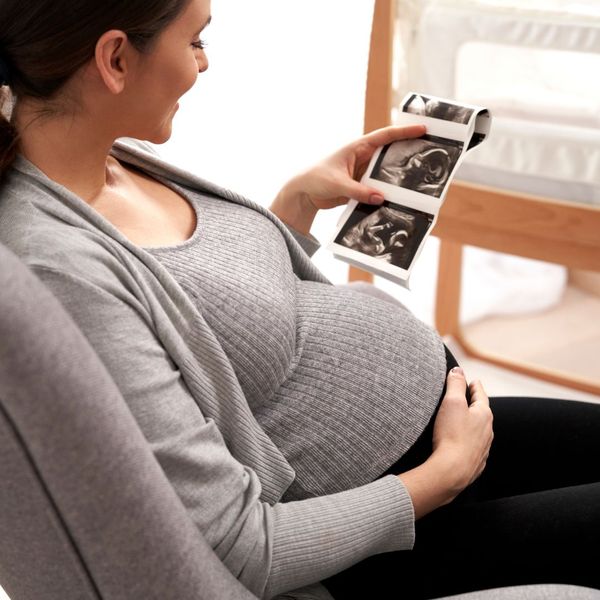 woman looking at ultrasound images