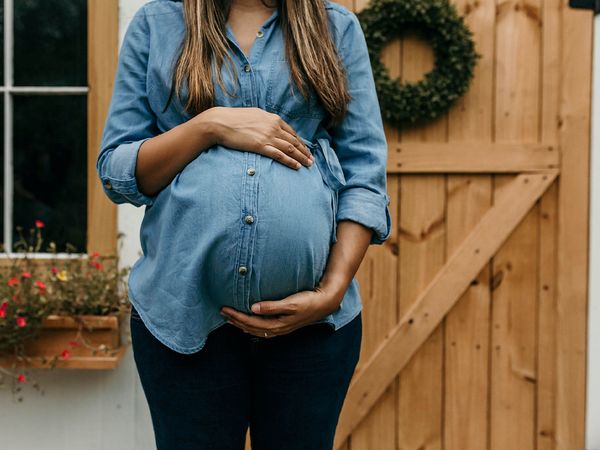 expectant mom holding her tummy