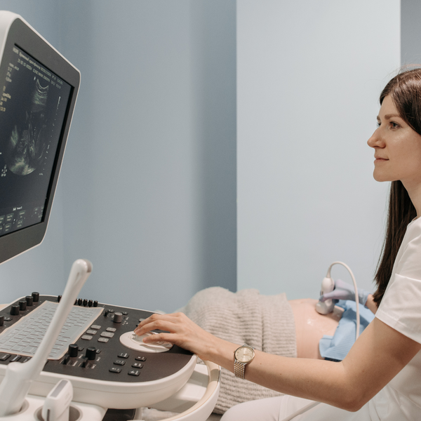 woman doctor performing ultrasound