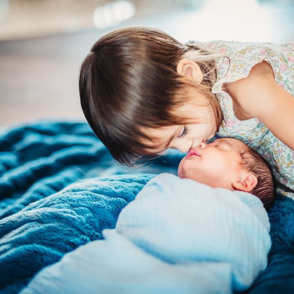 sister with new baby sibling