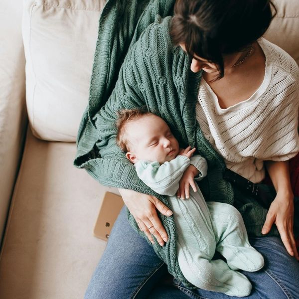 new mom holding sleeping newborn