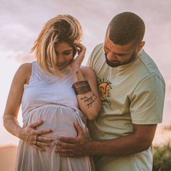 A couple embracing the baby bump