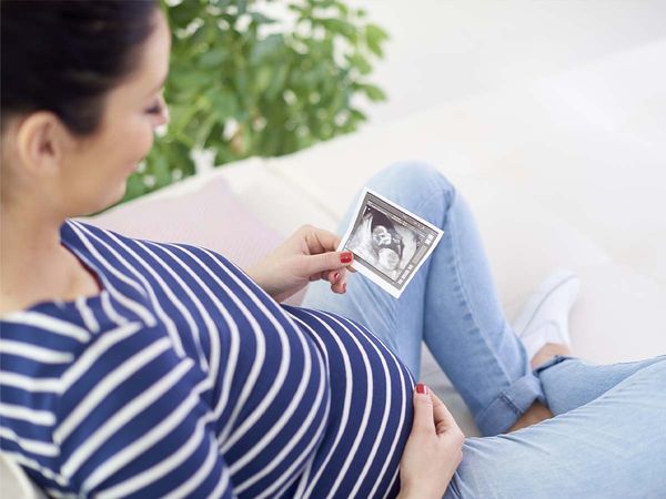 expectant mom with an ultrasound image