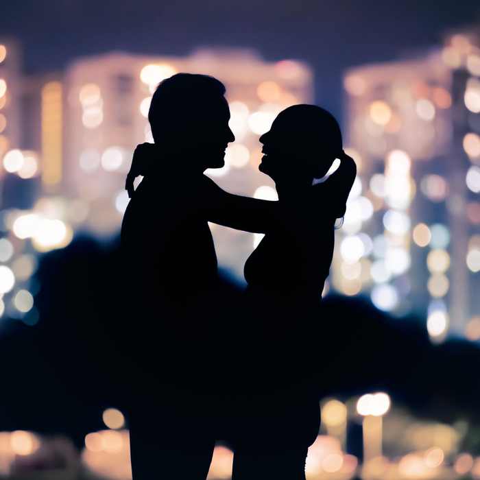 silhouettes of two people embracing