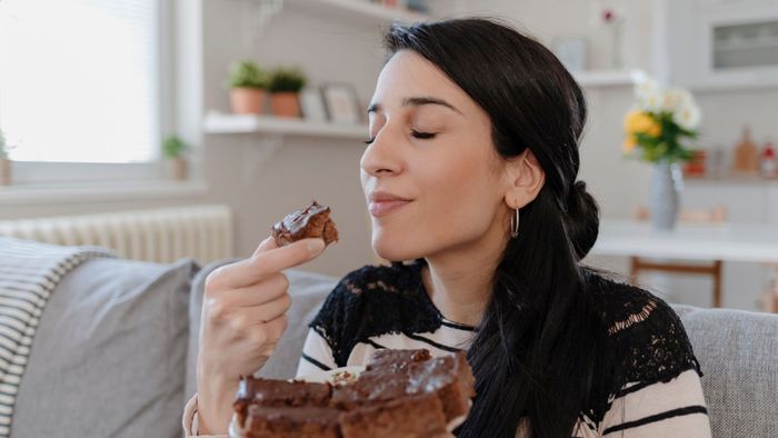 Woman eating cake