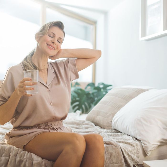 A woman stretches in the morning