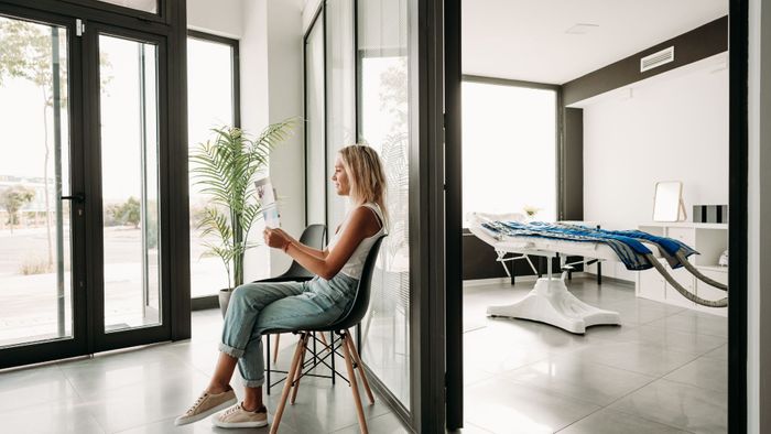 Woman sits in a wellness clinic