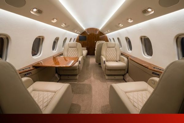a luxurious private jet cabin, showcasing a complete interior upholstery job with multiple seats and custom details