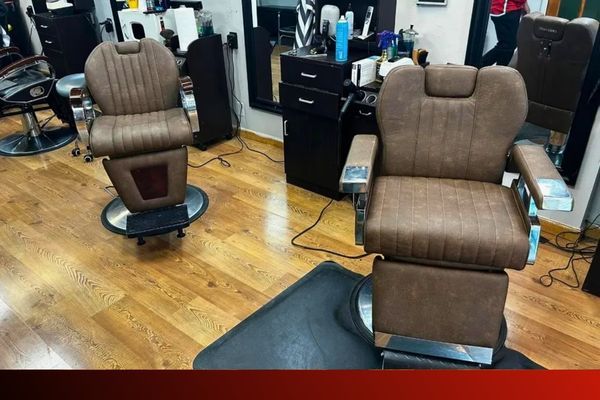 two upholstered barber chairs